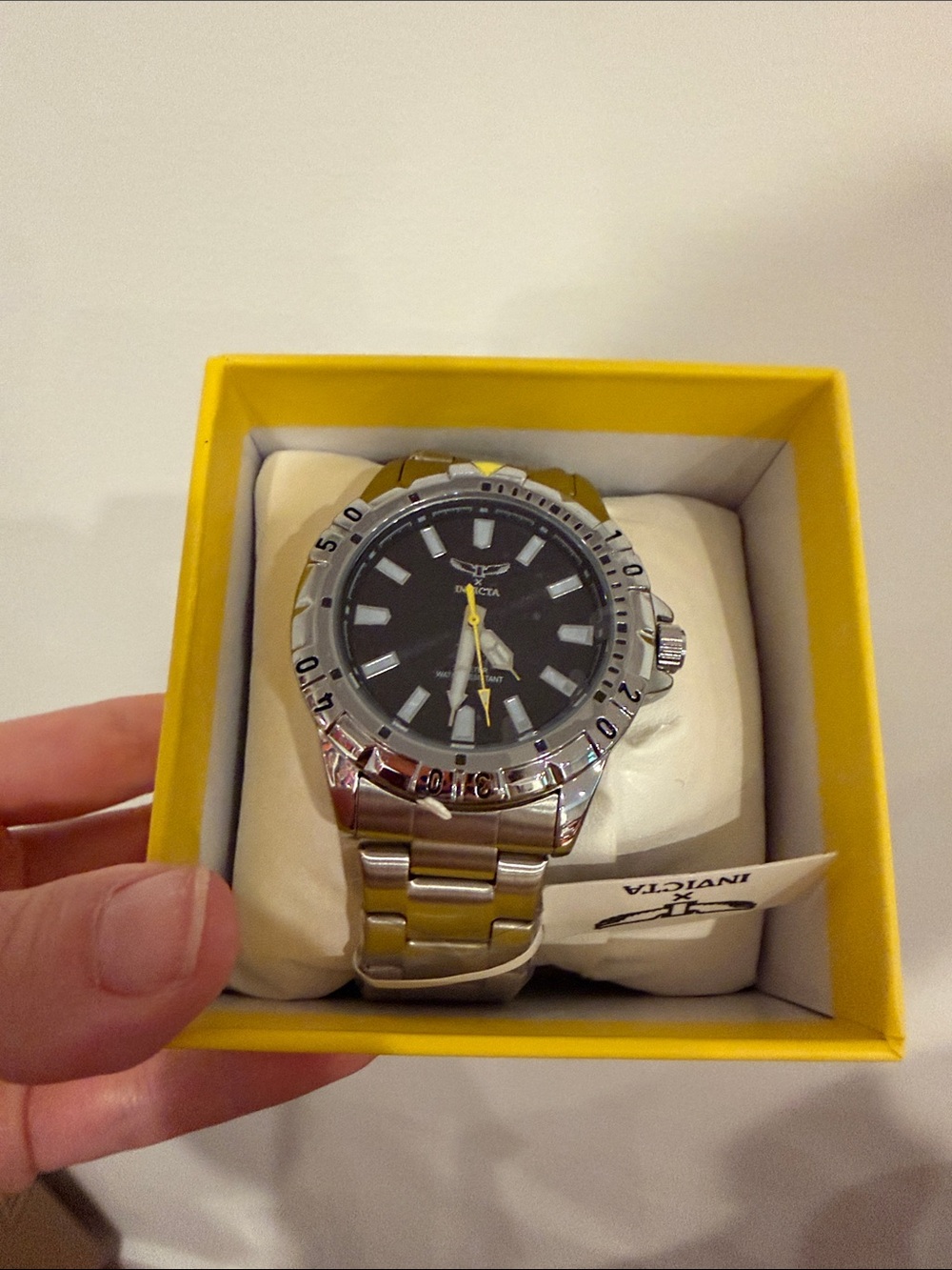 Invicta Silver Stainless Steel Watch with Black Dial and Yellow Seconds Hand